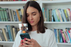 A woman looks her social media account